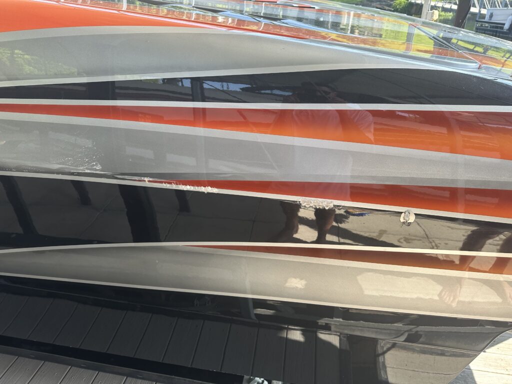 Boat-Waxing-Glossy-Finish-Sunrise-Property-Solutions-Camdenton Pristine boat after professional detailing in Sunrise Beach.